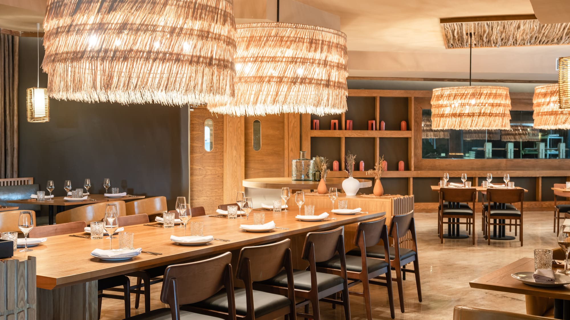 a large dining room with a large table and chairs