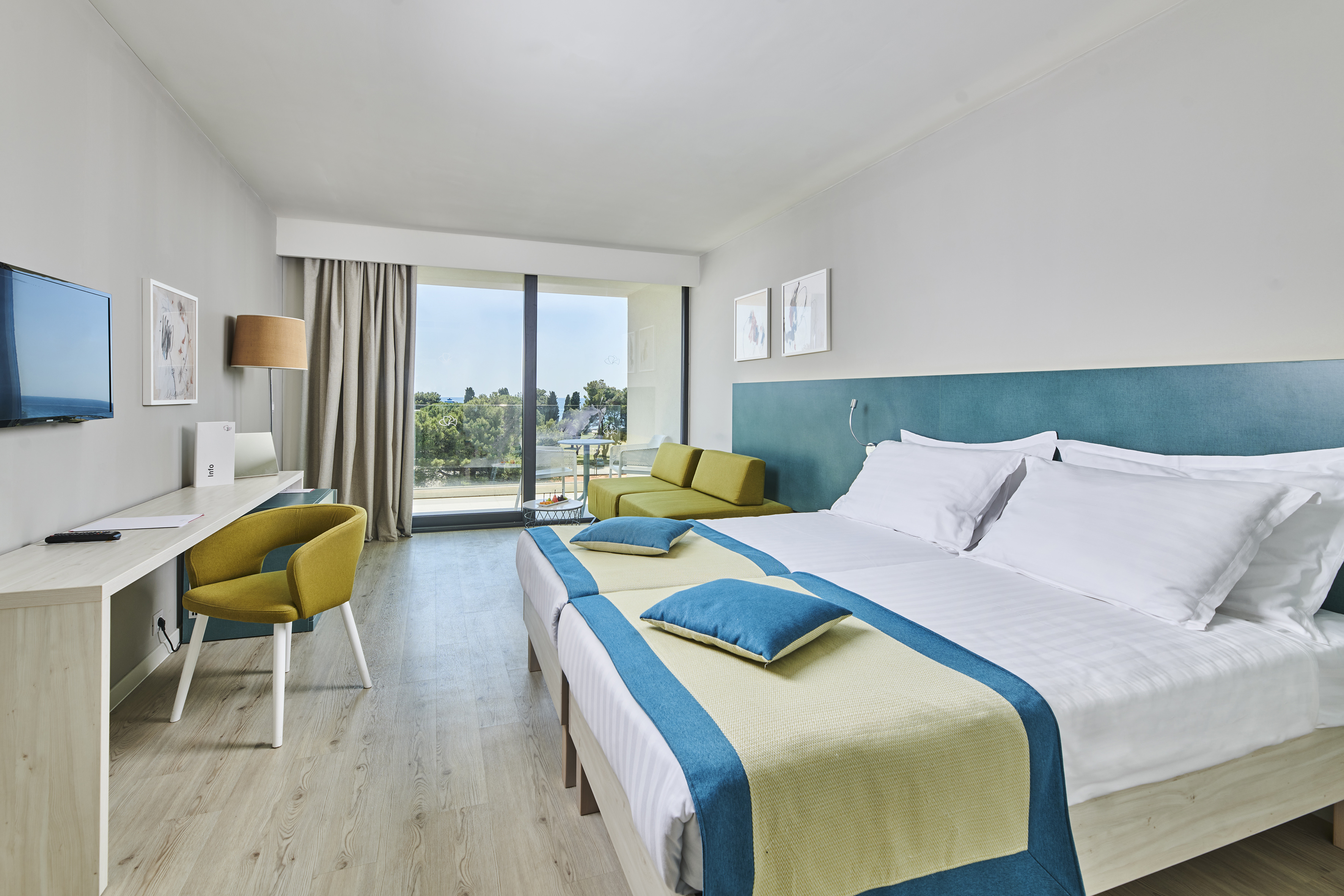 a room with a bed and a desk