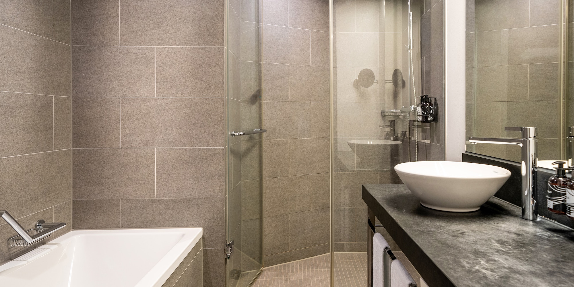 a bathroom with a sink and shower