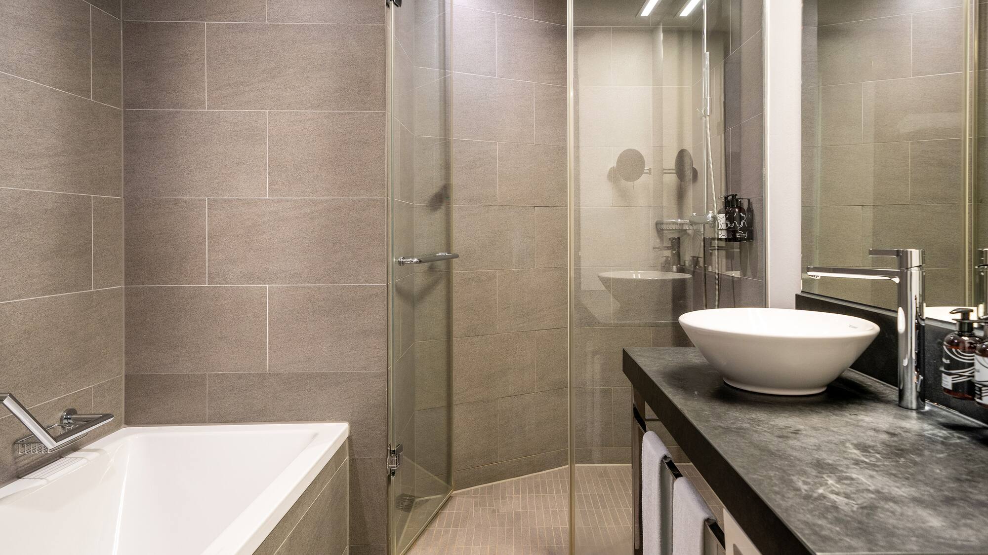 a bathroom with a sink and shower