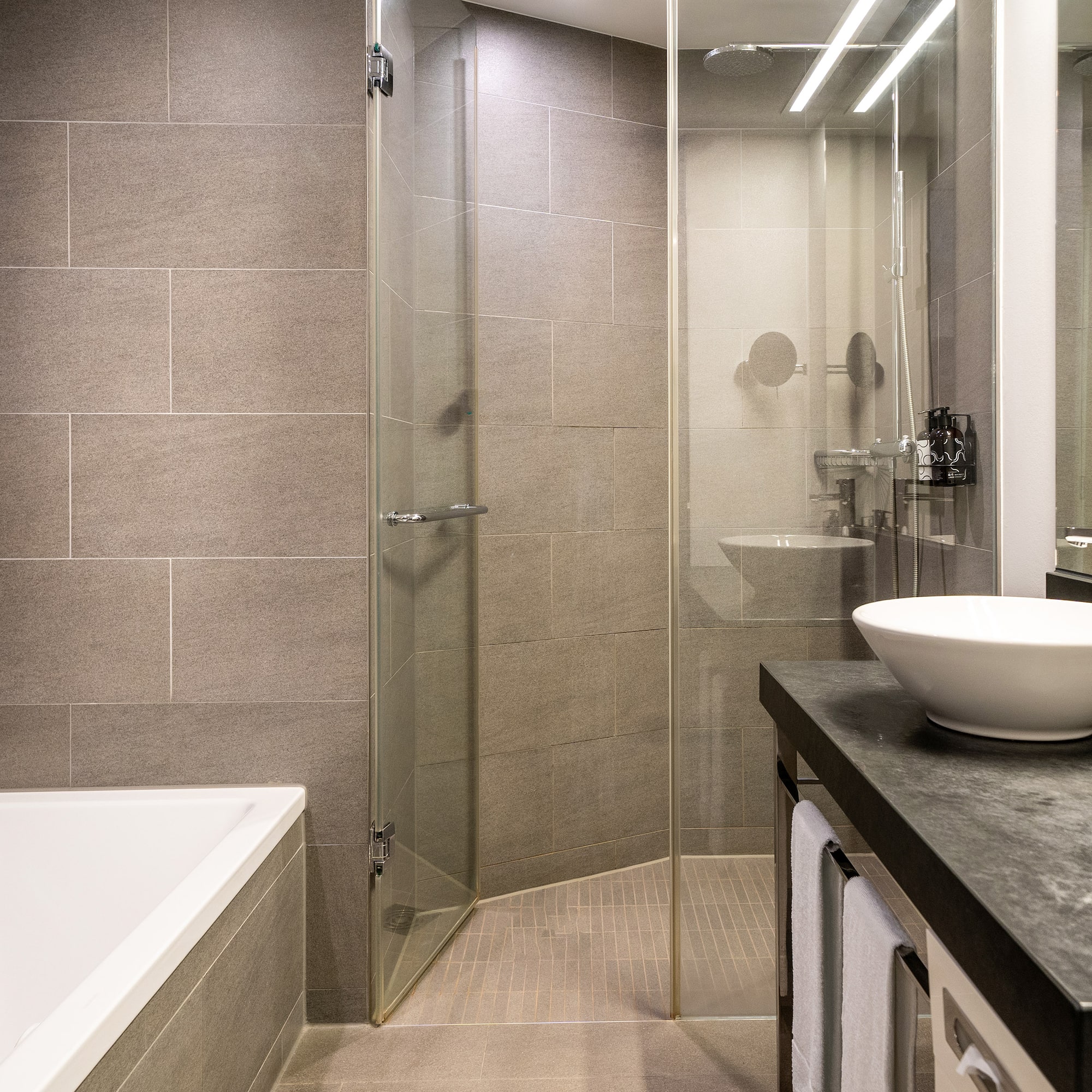 a bathroom with a sink and shower