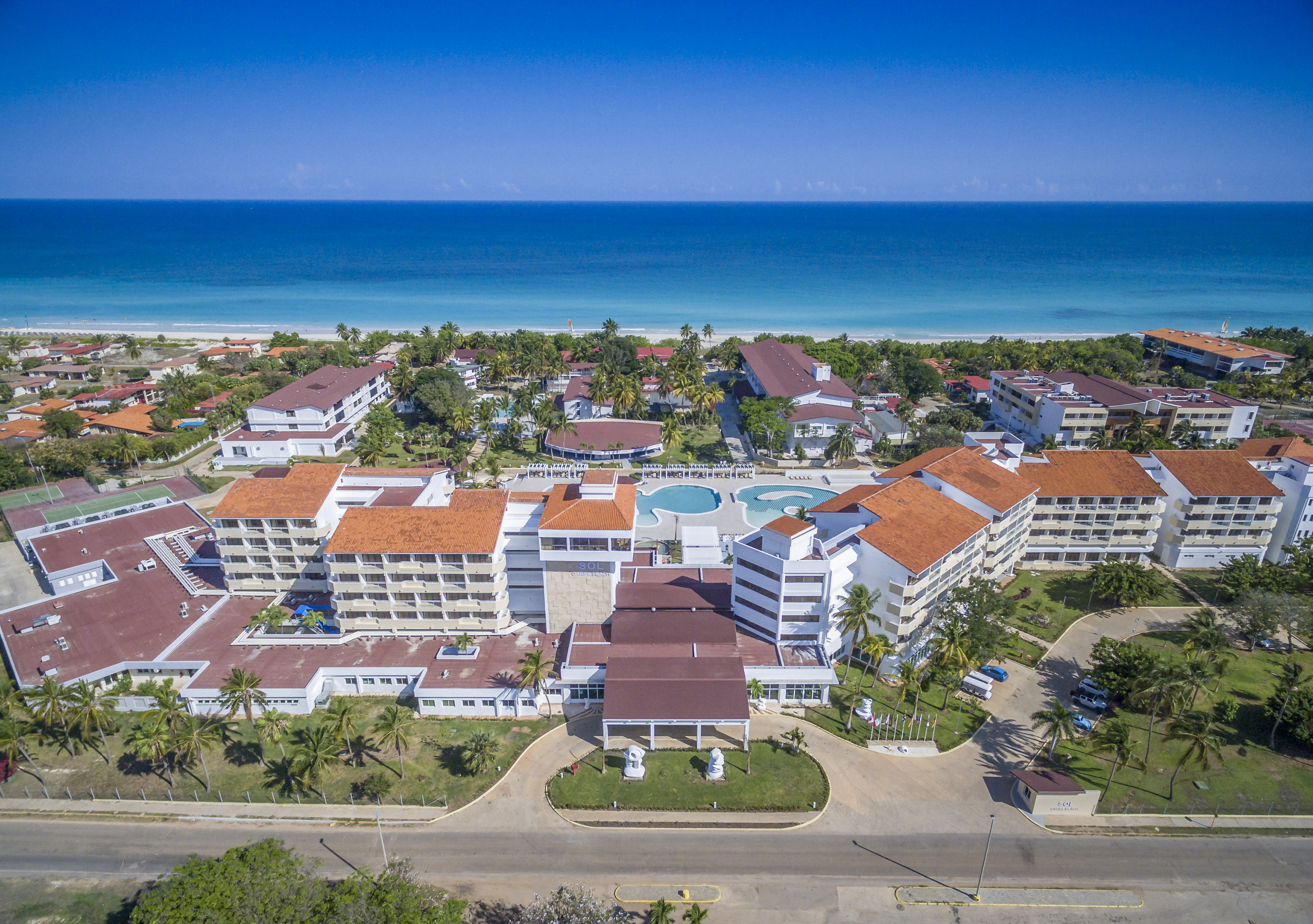 a group of buildings next to a beach