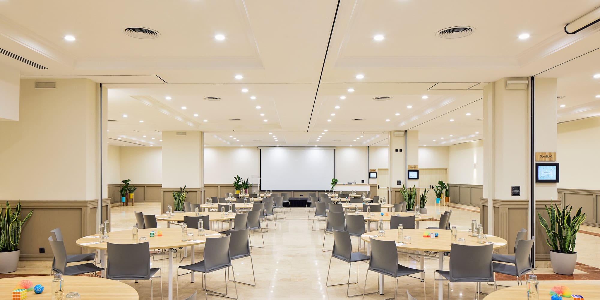 a room with tables and chairs