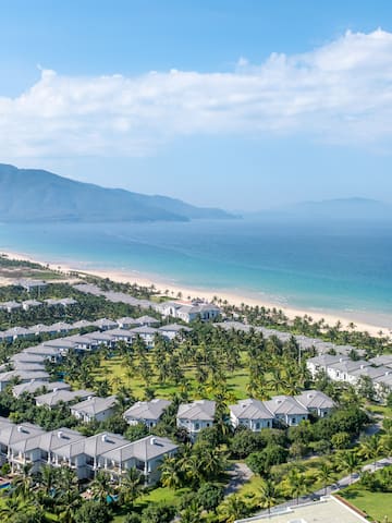 a group of houses on a beach