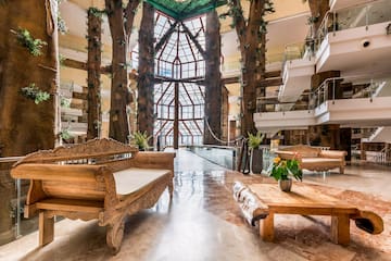 a large tree-like building with a glass ceiling and a large window