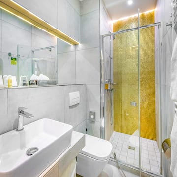 a bathroom with a shower and sink