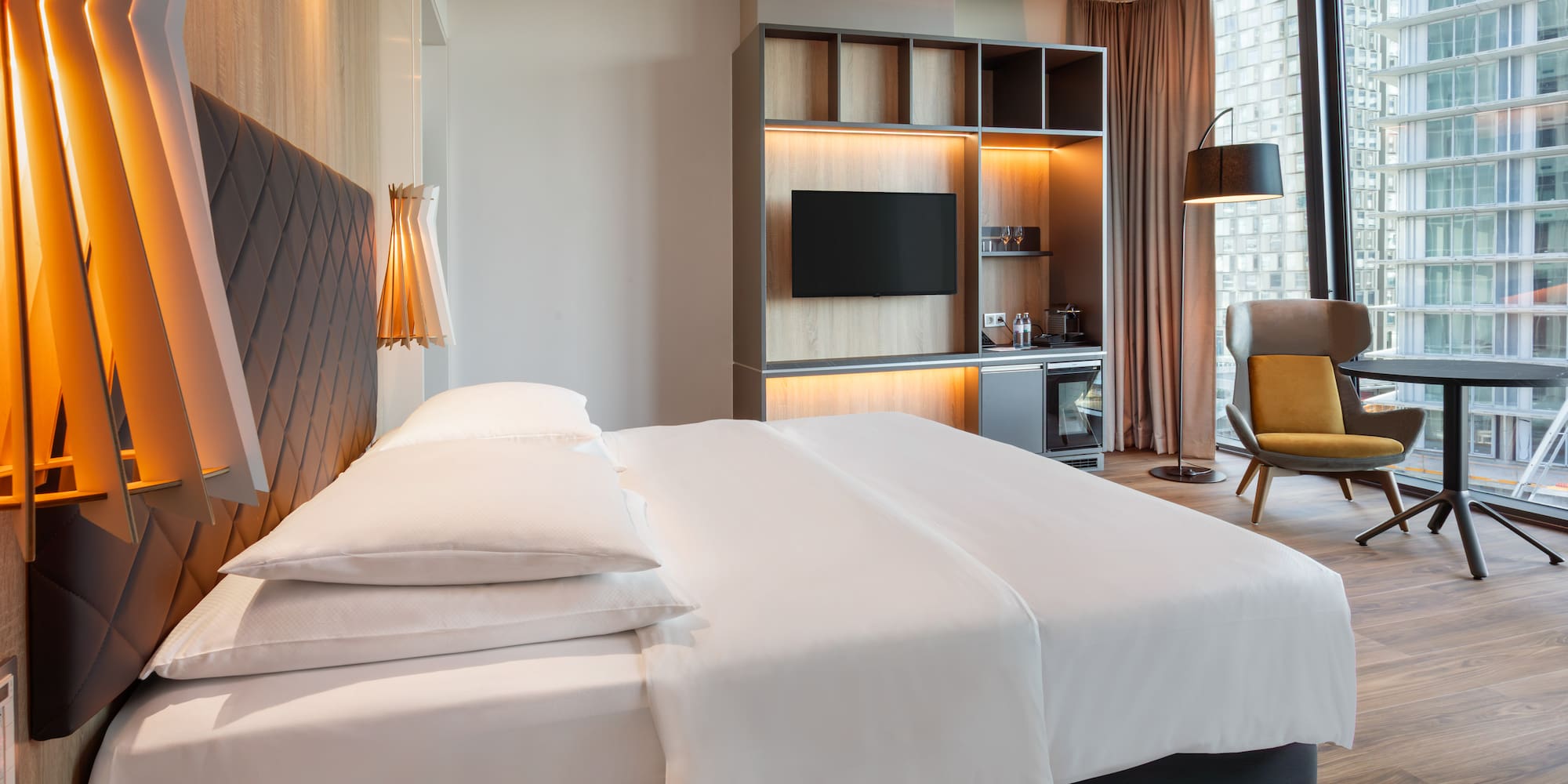 a room with a bed and a tv