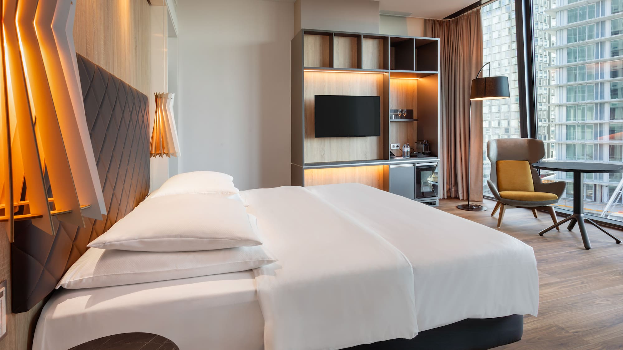 a room with a bed and a tv