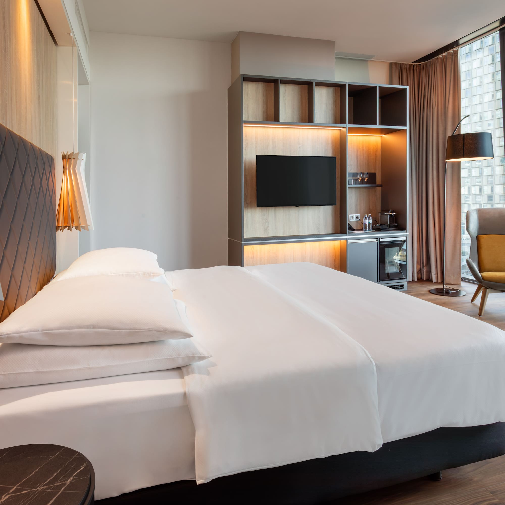 a room with a bed and a tv