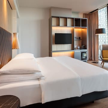 a room with a bed and a tv