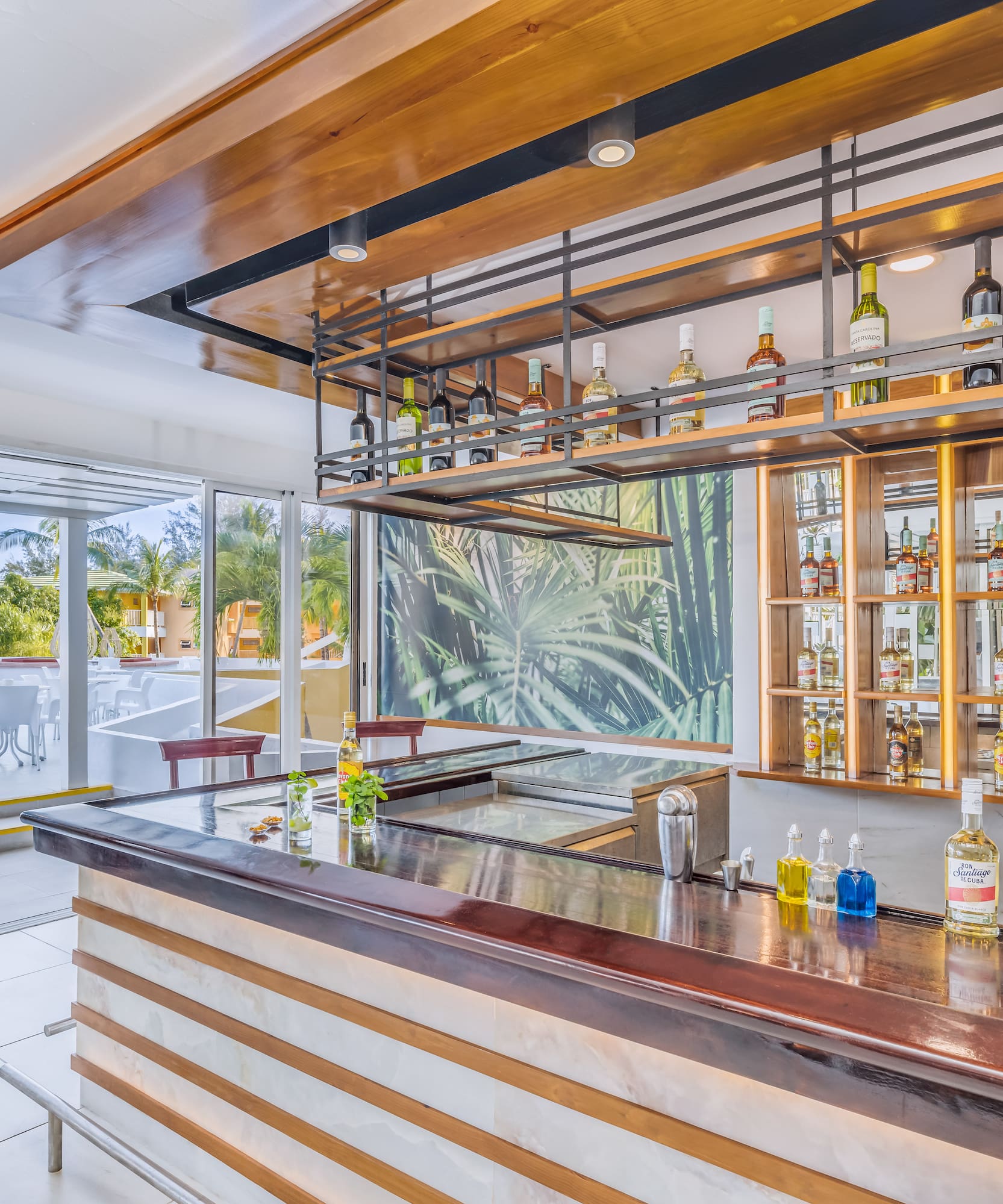 a bar with bottles of liquor on the counter