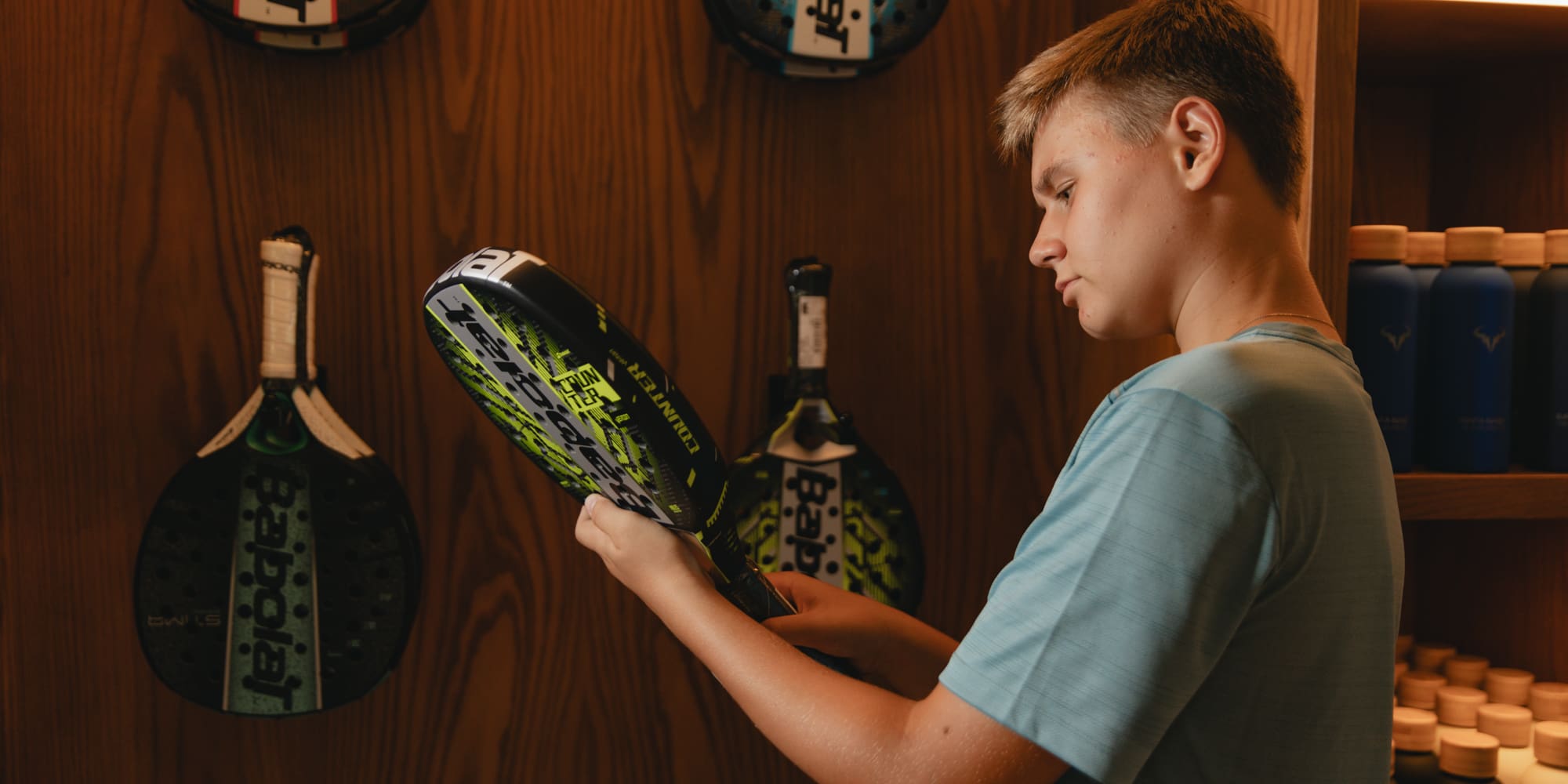 a man holding a tennis racket