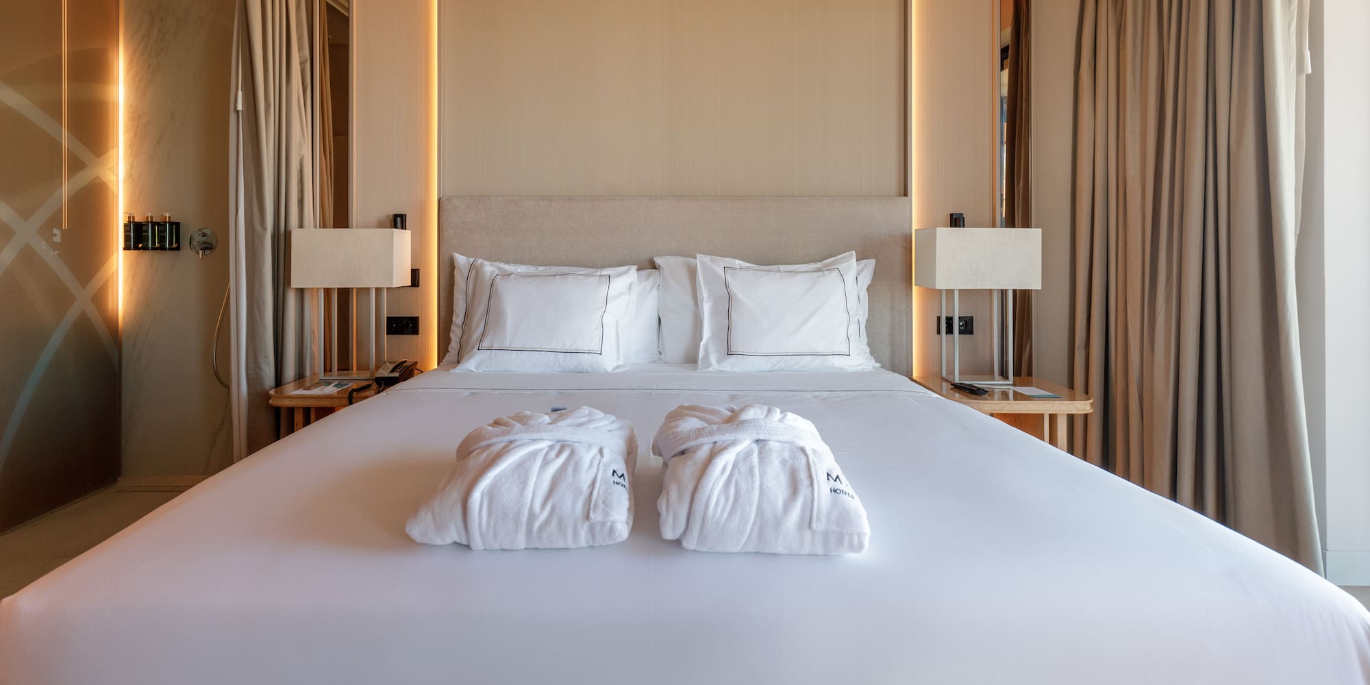 a bed with white towels on it