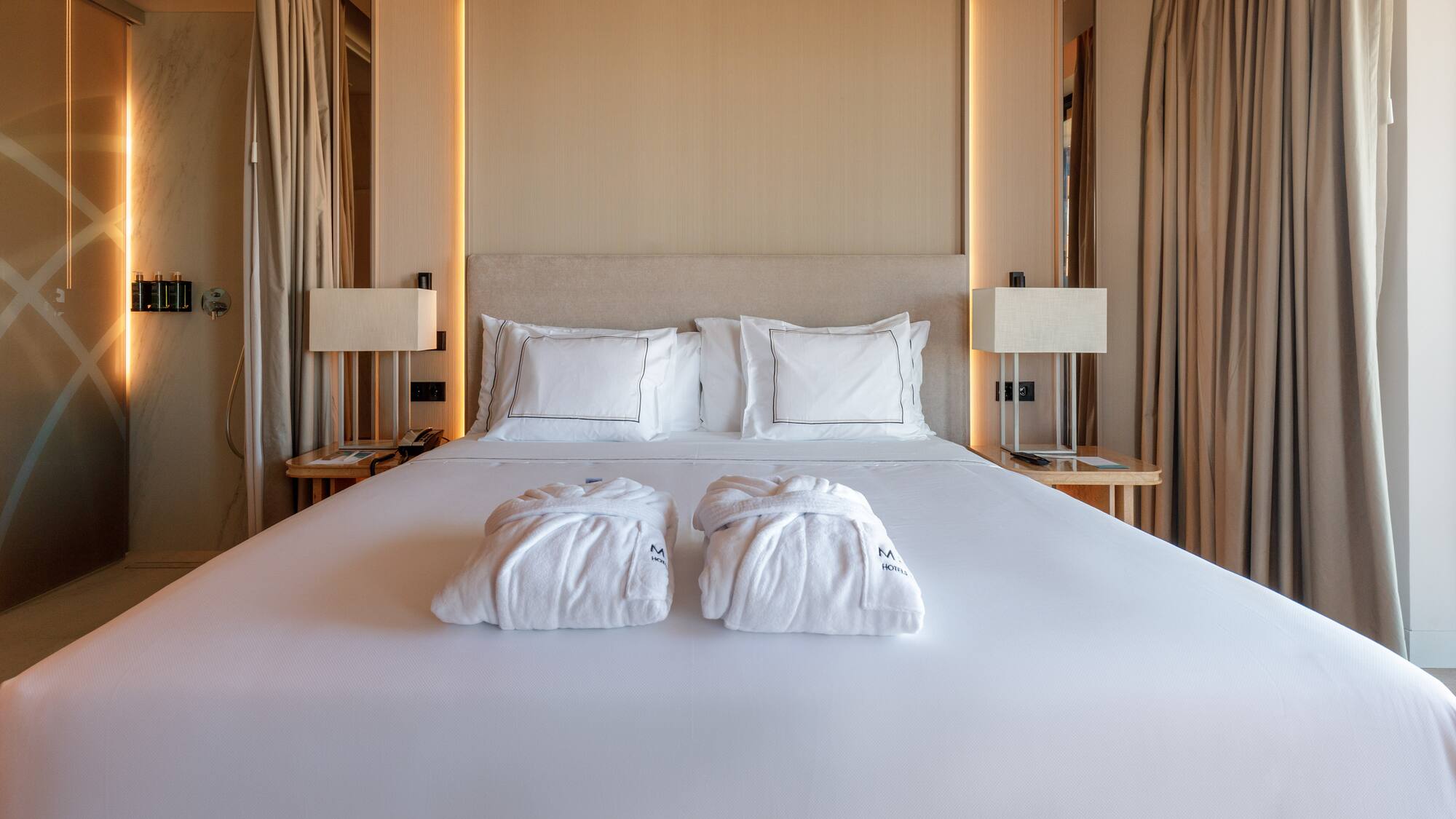 a bed with white towels on it