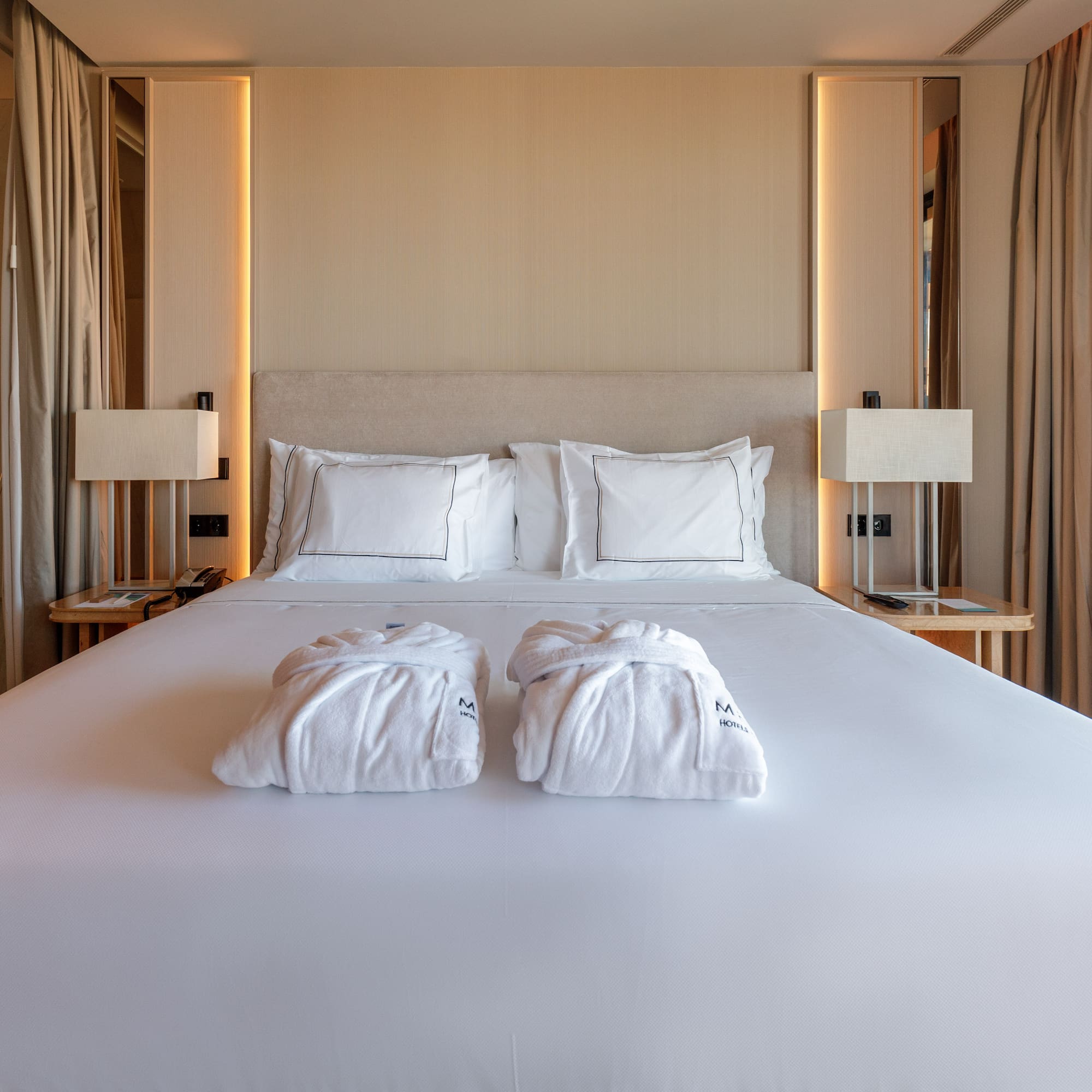 a bed with white towels on it