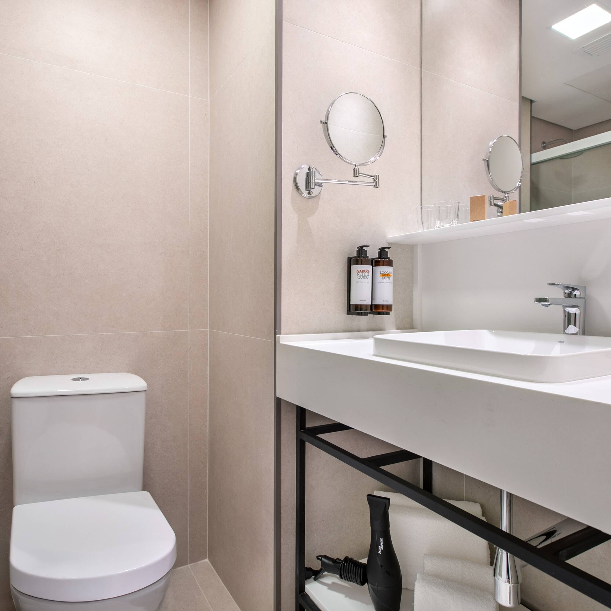 a bathroom with a sink and mirror
