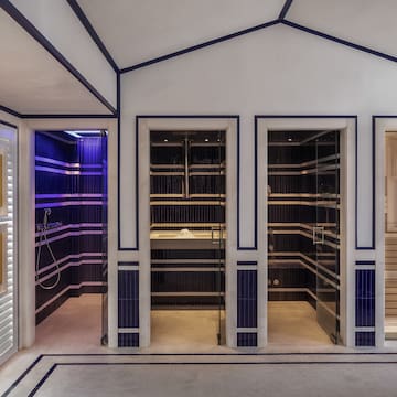 a room with a sauna and shower