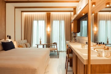 a bedroom with a tv and a table