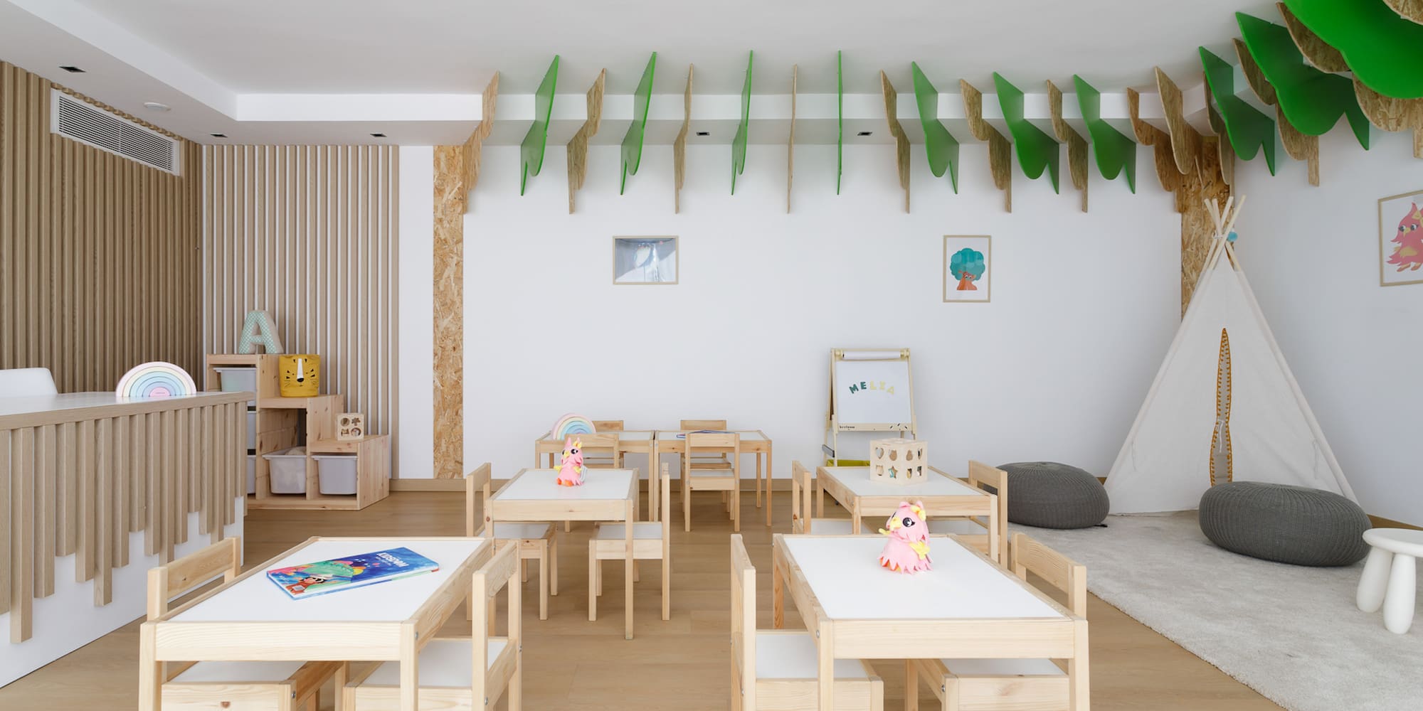 a room with white tables and chairs