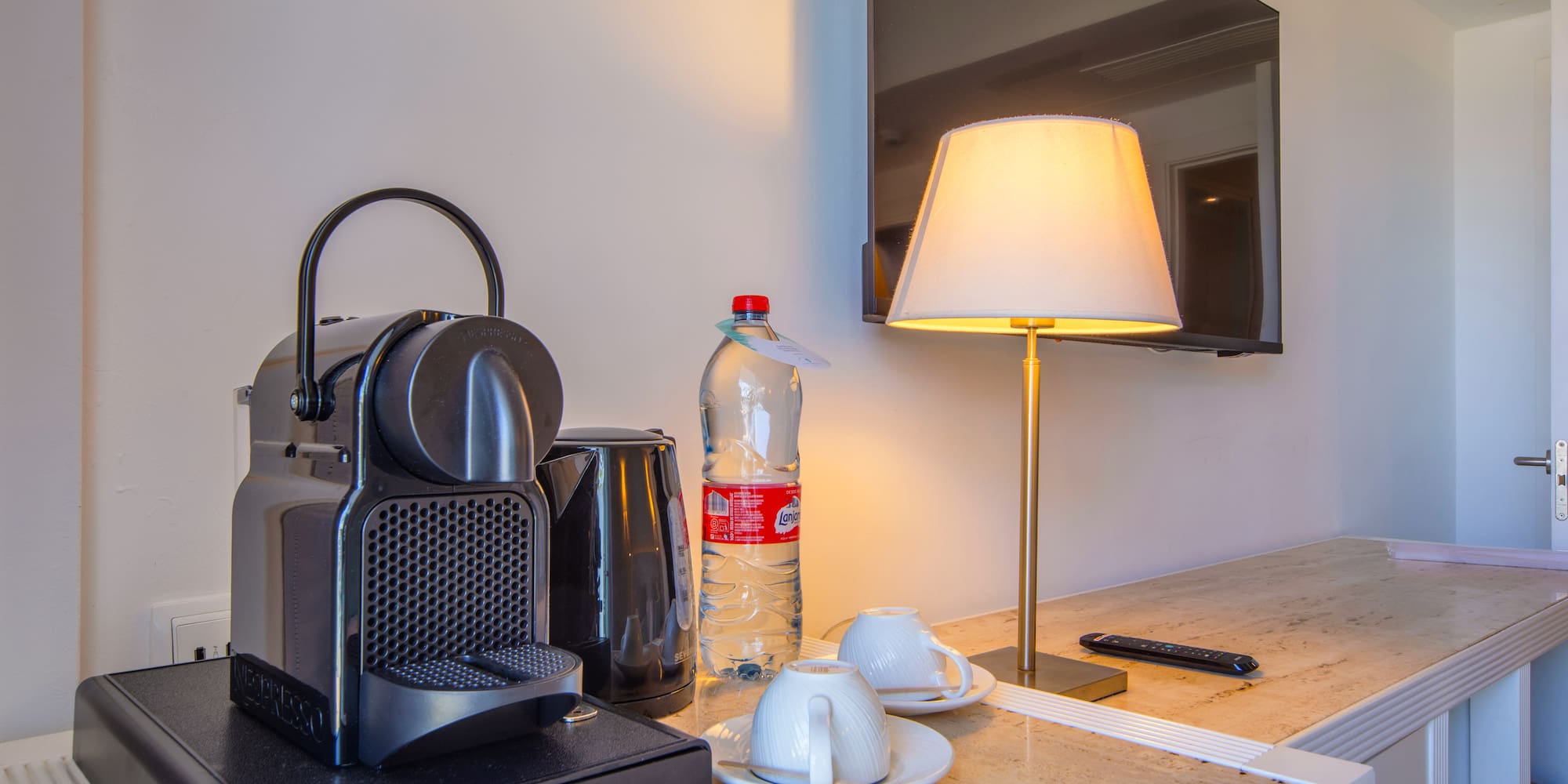 a coffee machine and a lamp on a counter