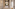 Luxury hotel reception with arched entry, front desk, and checkered floor.