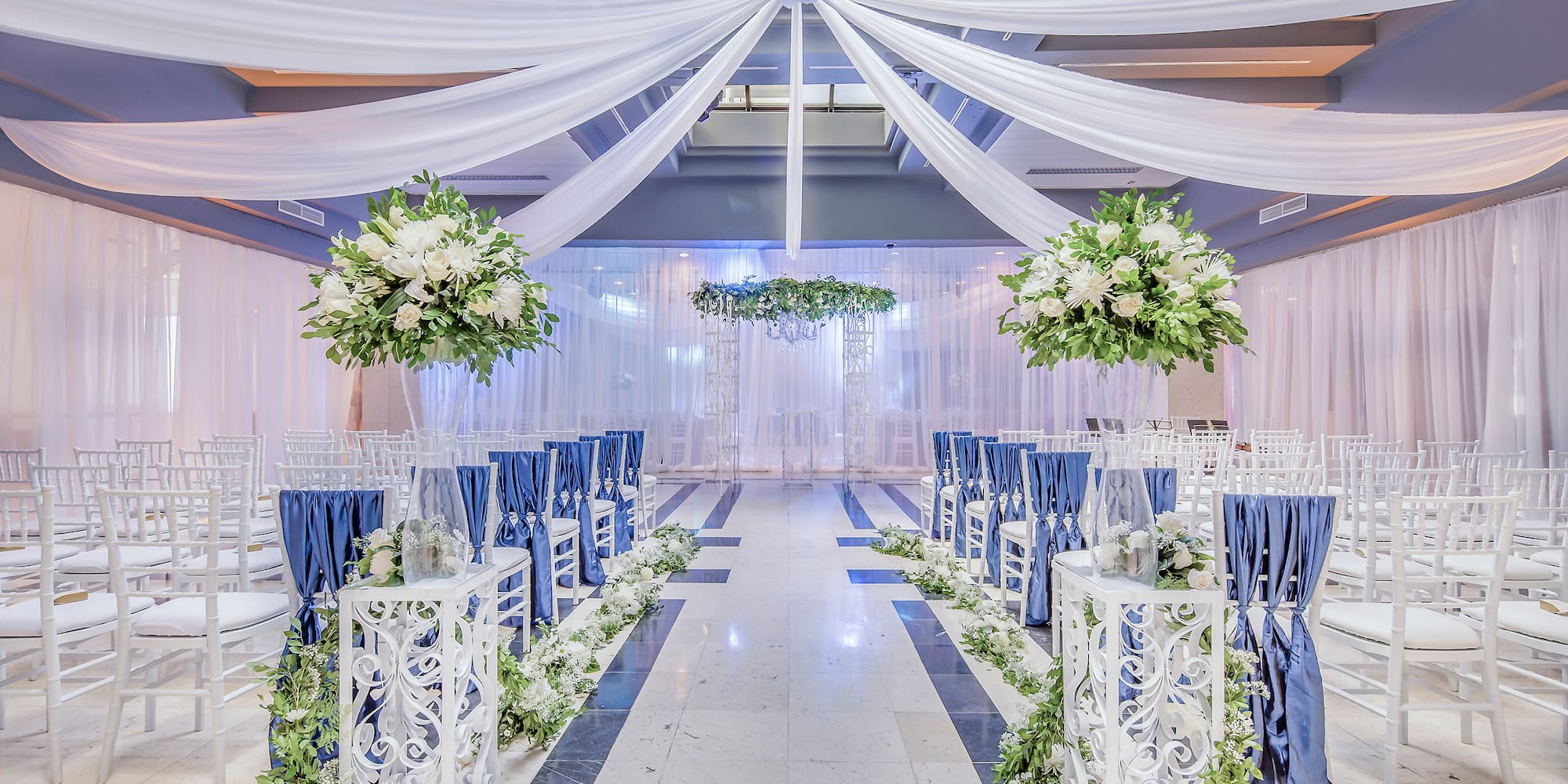 a wedding venue with chairs and tables