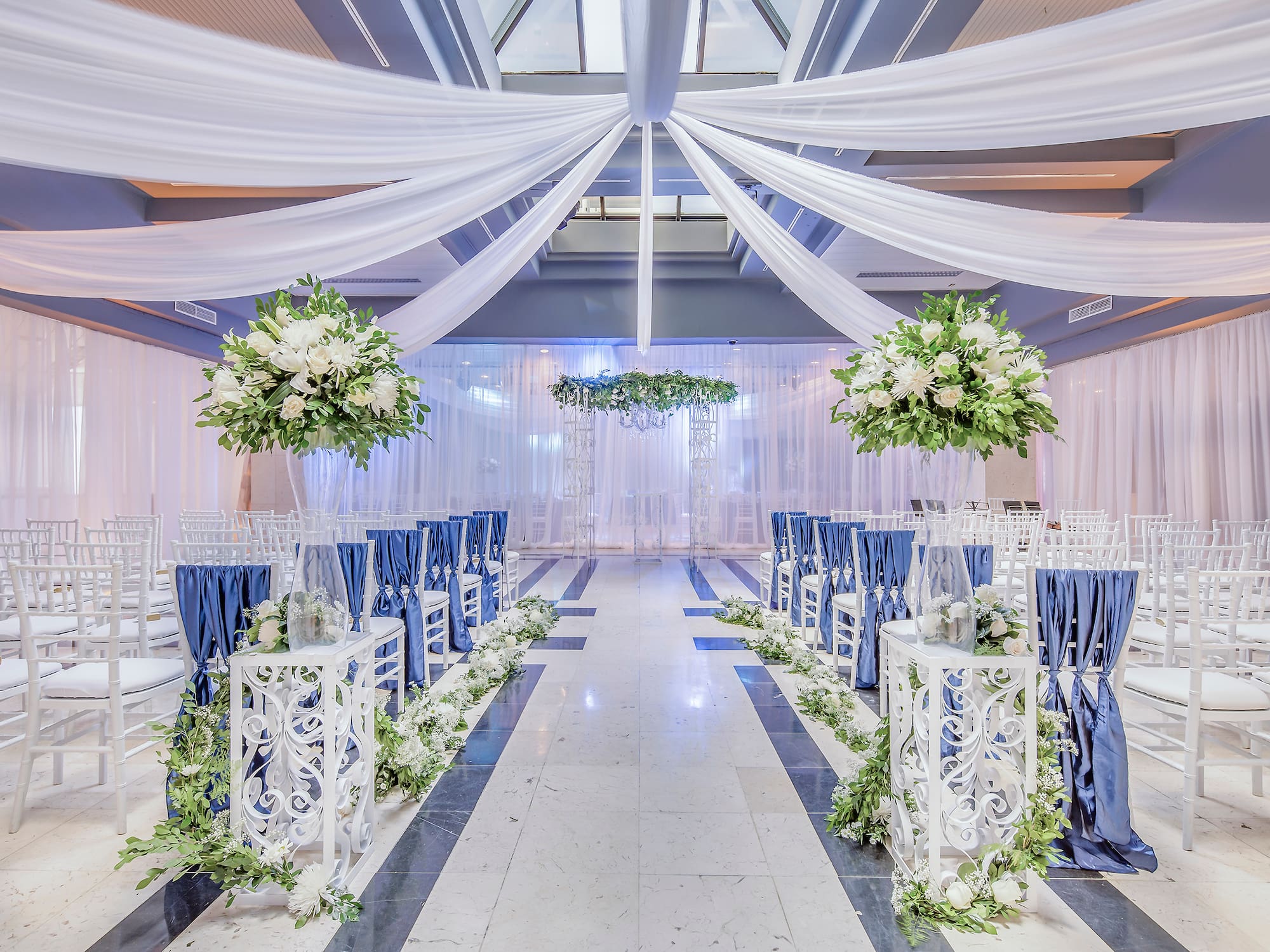 a wedding venue with chairs and tables