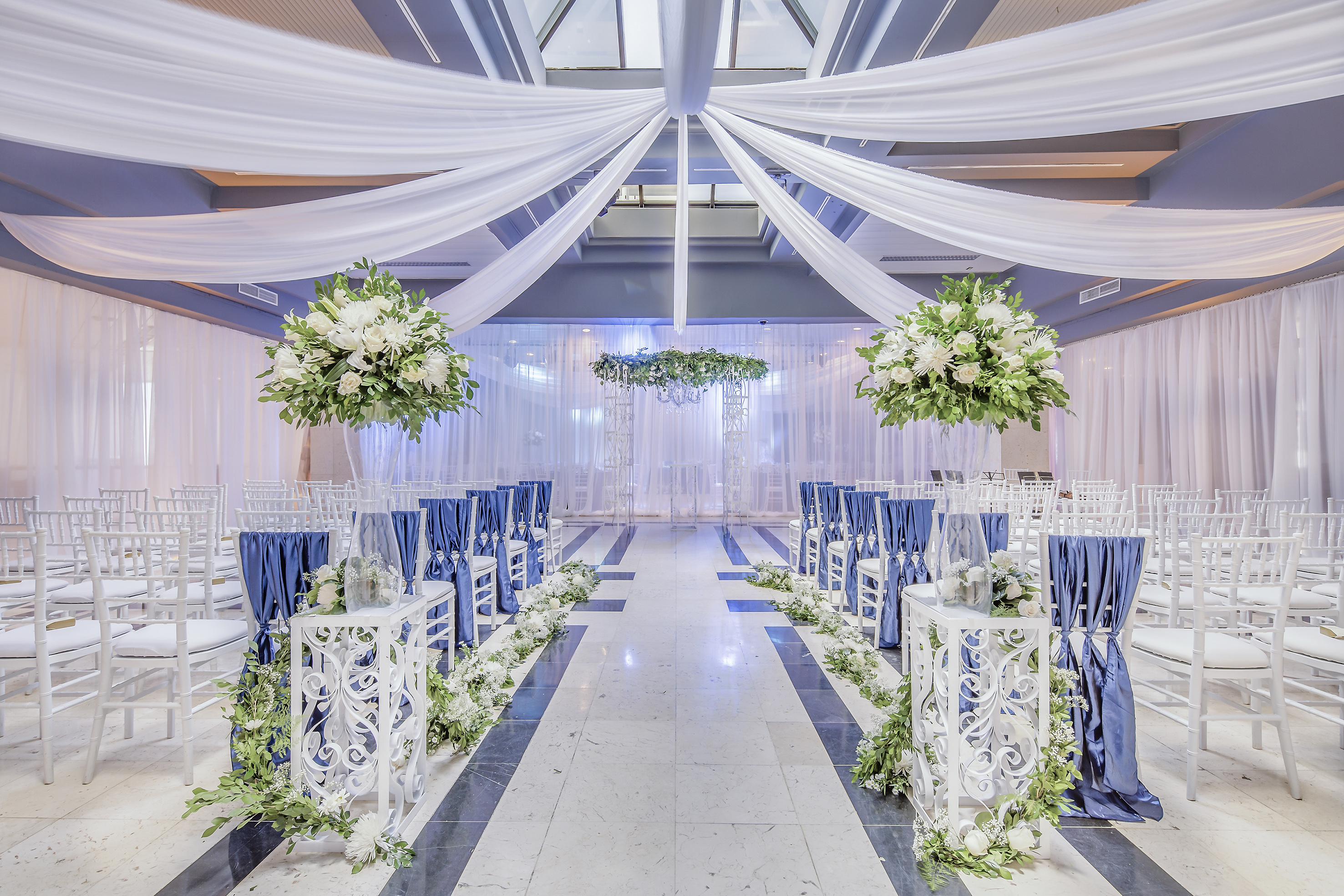 a wedding venue with chairs and tables
