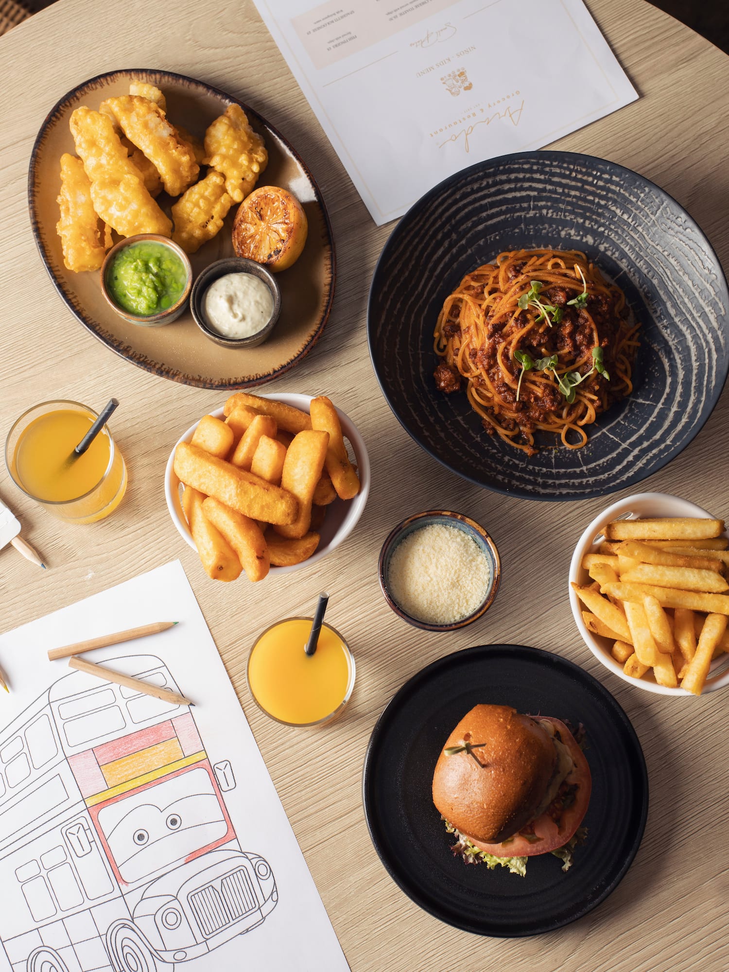 Kids' menu items: fish & chips, spaghetti, burger, fries, juice, and coloring page.
