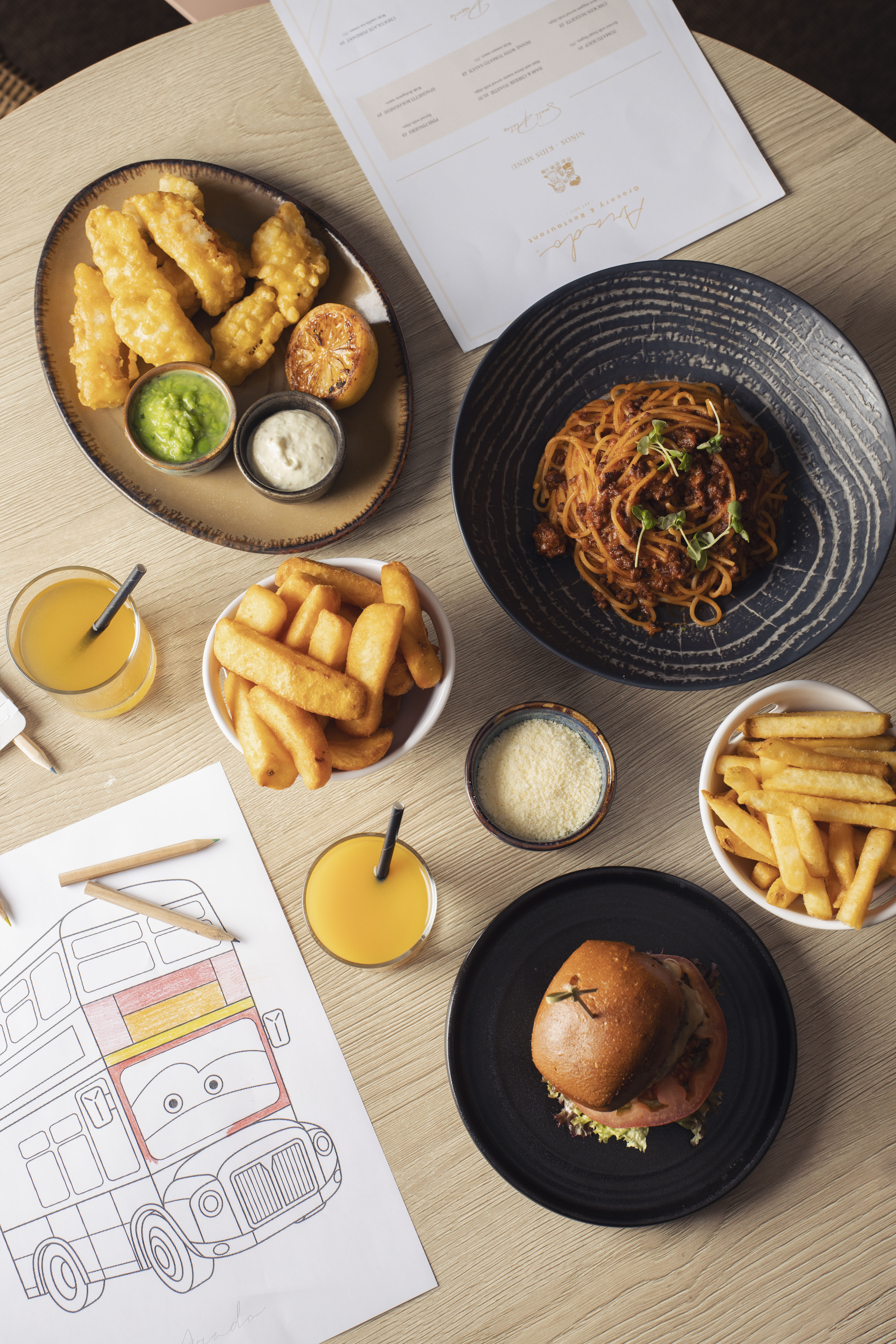 Kids' menu items: fish & chips, spaghetti, burger, fries, juice, and coloring page.