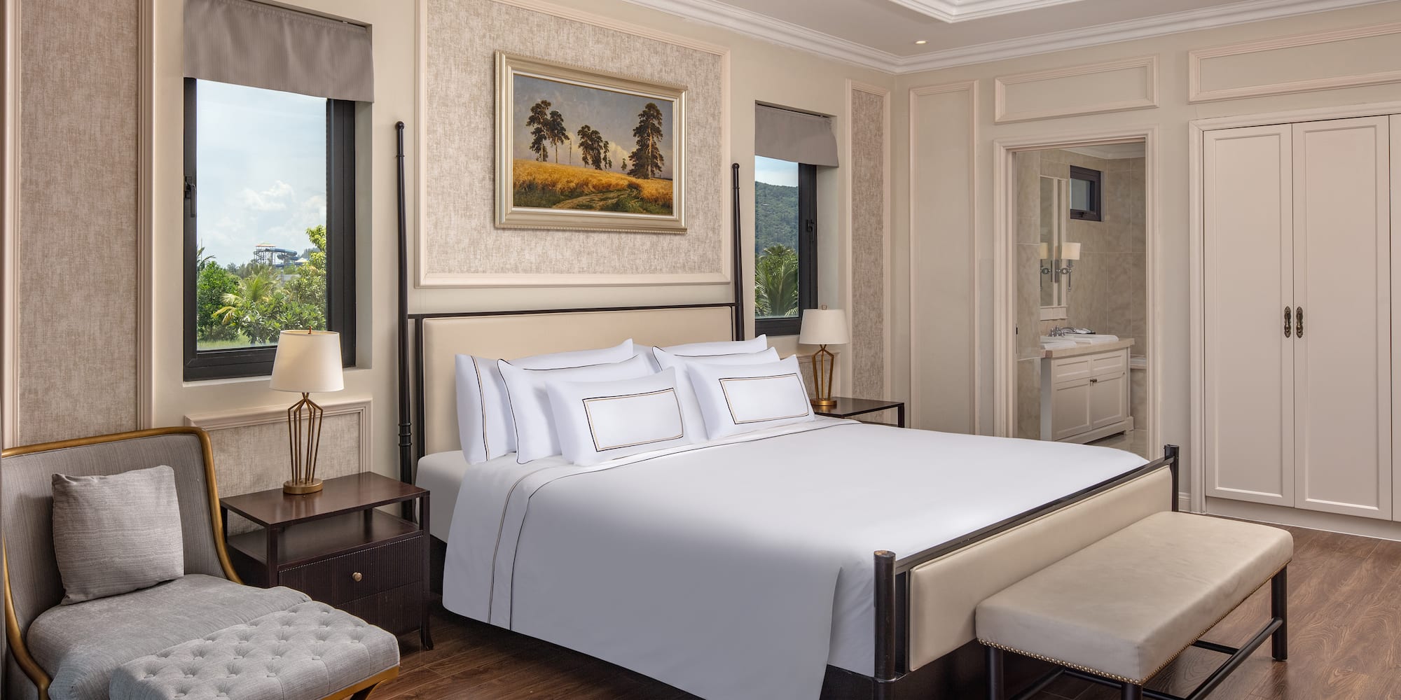 a bedroom with a bed and a bench