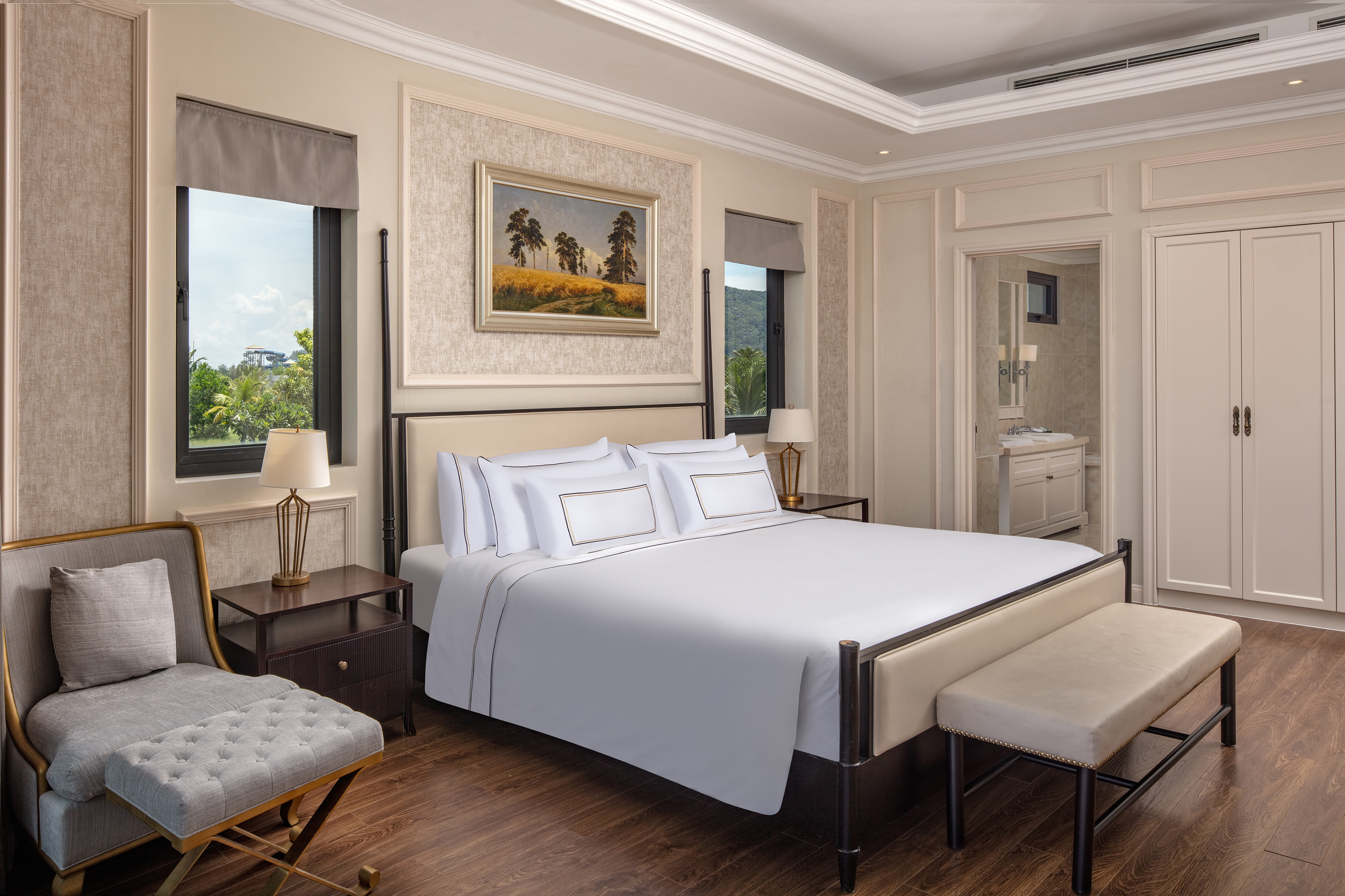 a bedroom with a bed and a bench