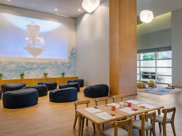 a room with a large projector screen