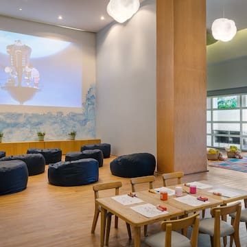 a room with a large projector screen