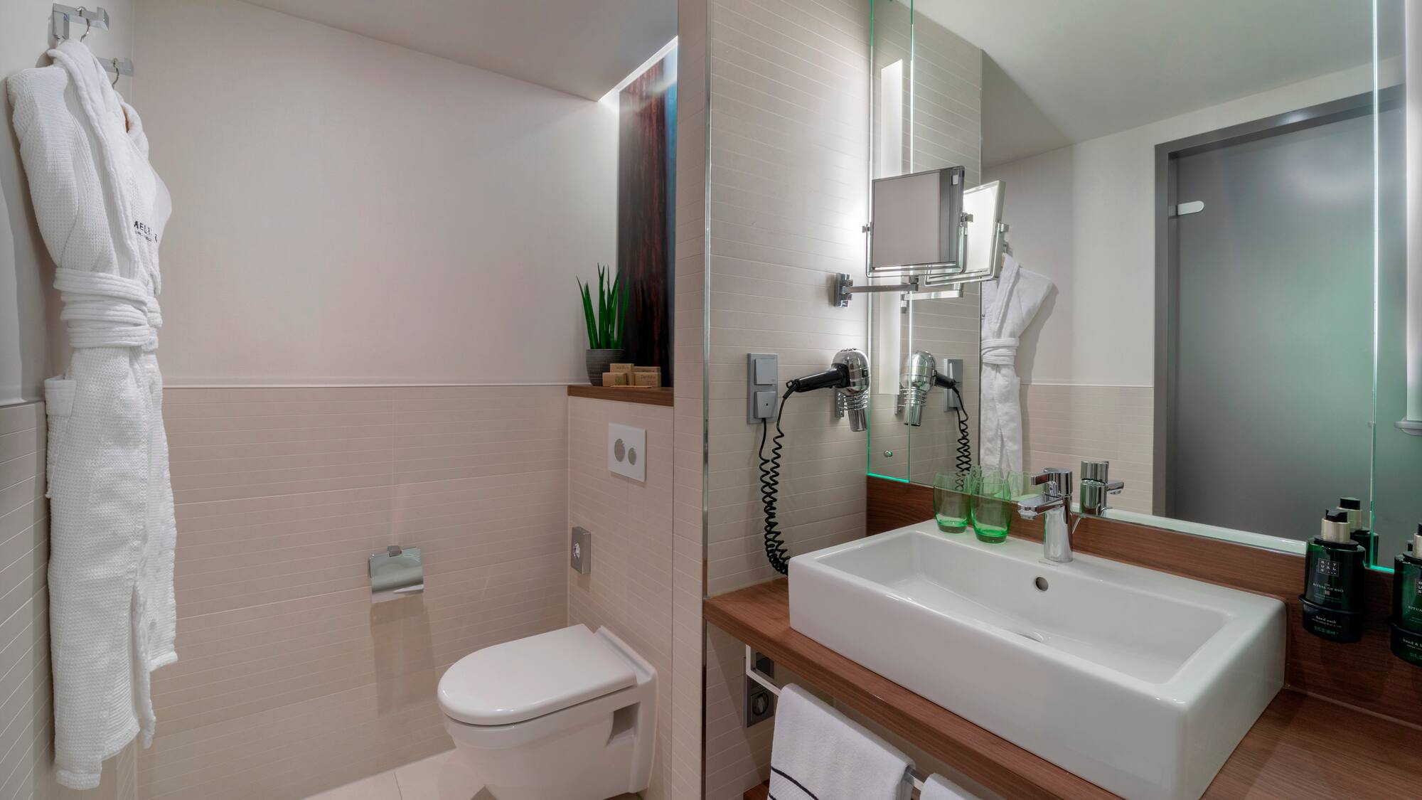 a bathroom with a sink and toilet