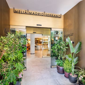 a entrance to a building with plants