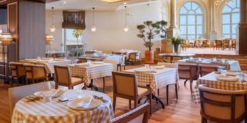 a restaurant with tables and chairs