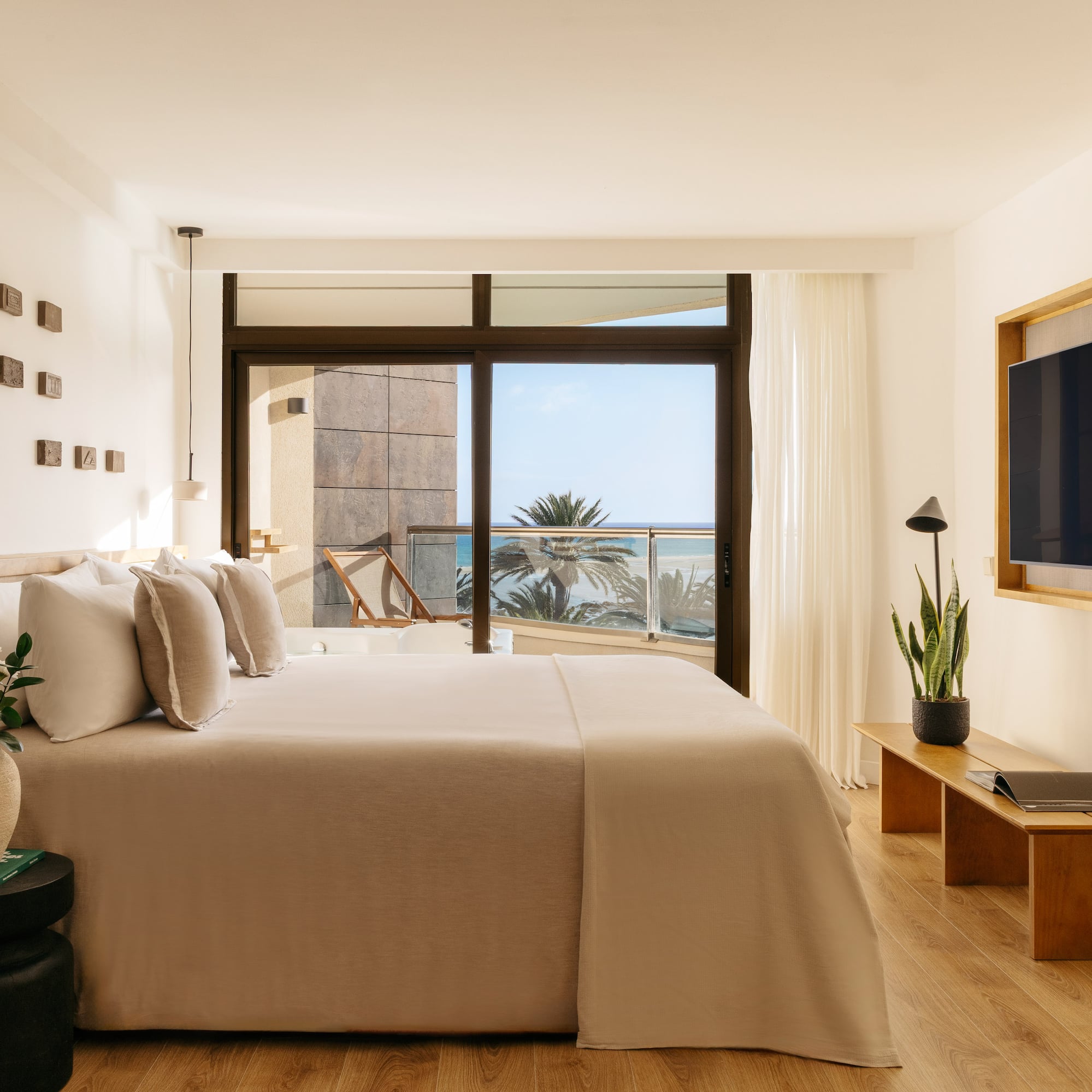 a bedroom with a television and a bed