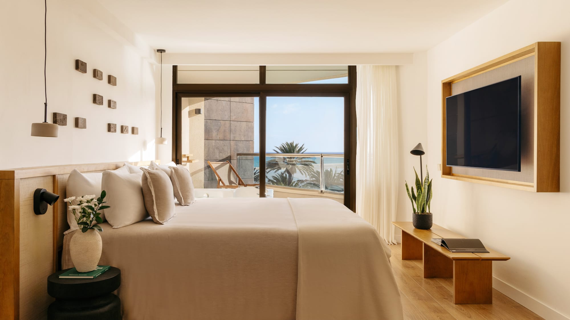 a bedroom with a television and a bed