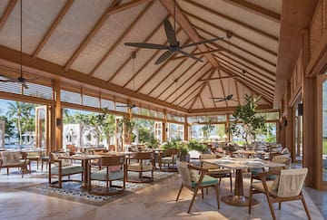 a restaurant with tables and chairs