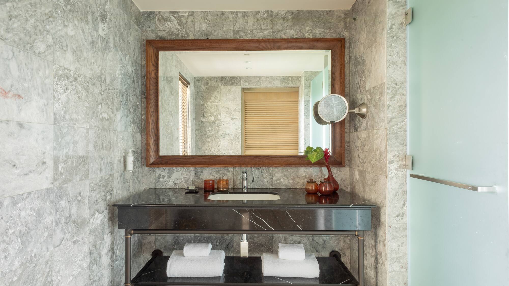a bathroom with a mirror and a sink