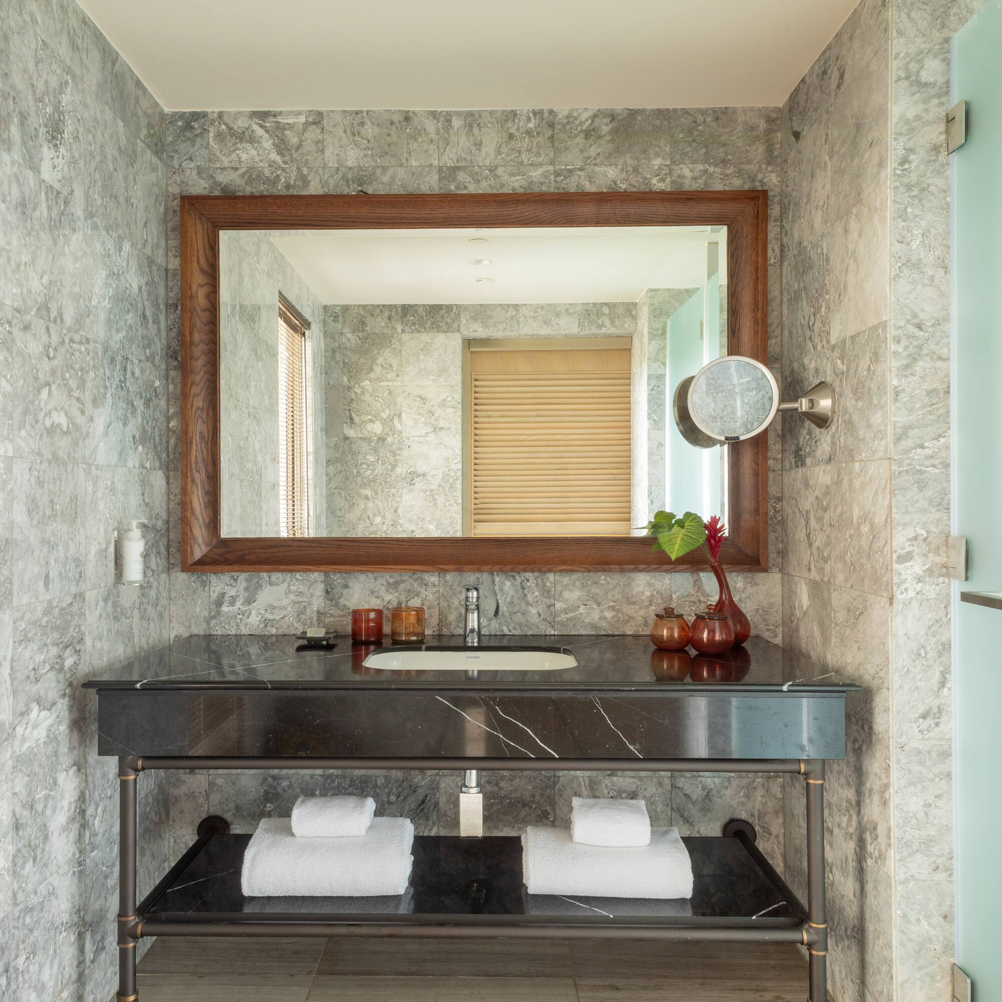 a bathroom with a mirror and a sink