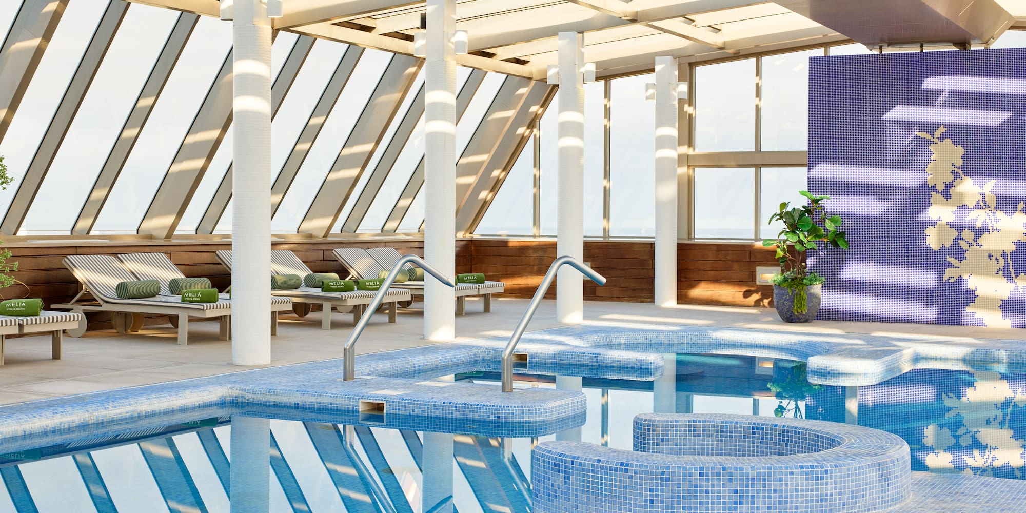 a pool with a glass roof