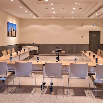 a room with a conference table and chairs