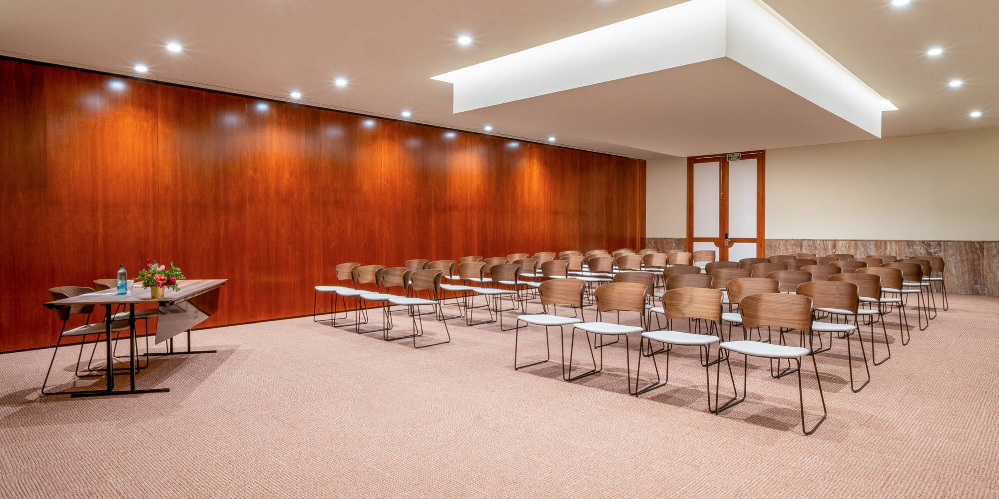 a room with many chairs and tables