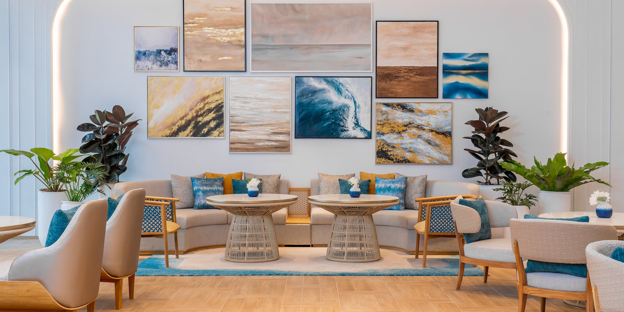 a room with a couch and chairs