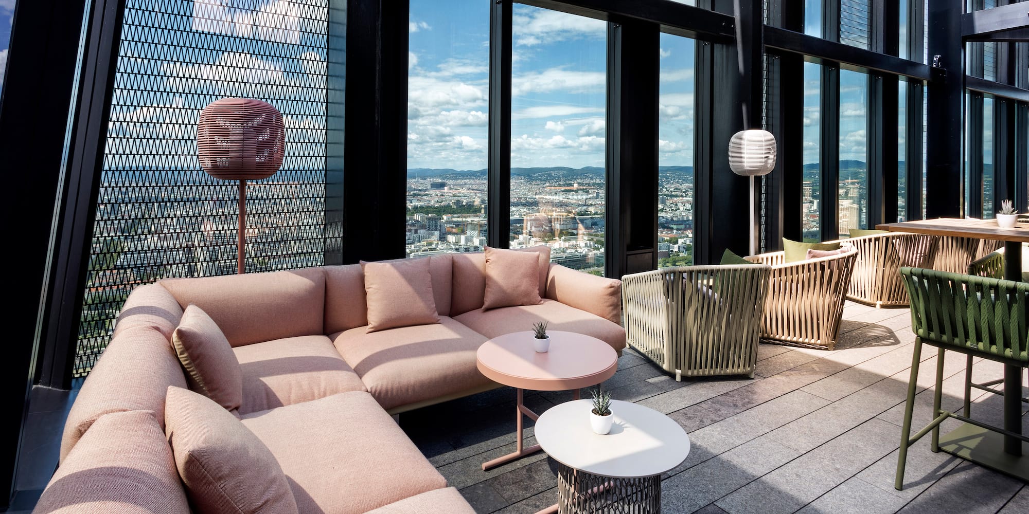 a room with a couch and tables and chairs