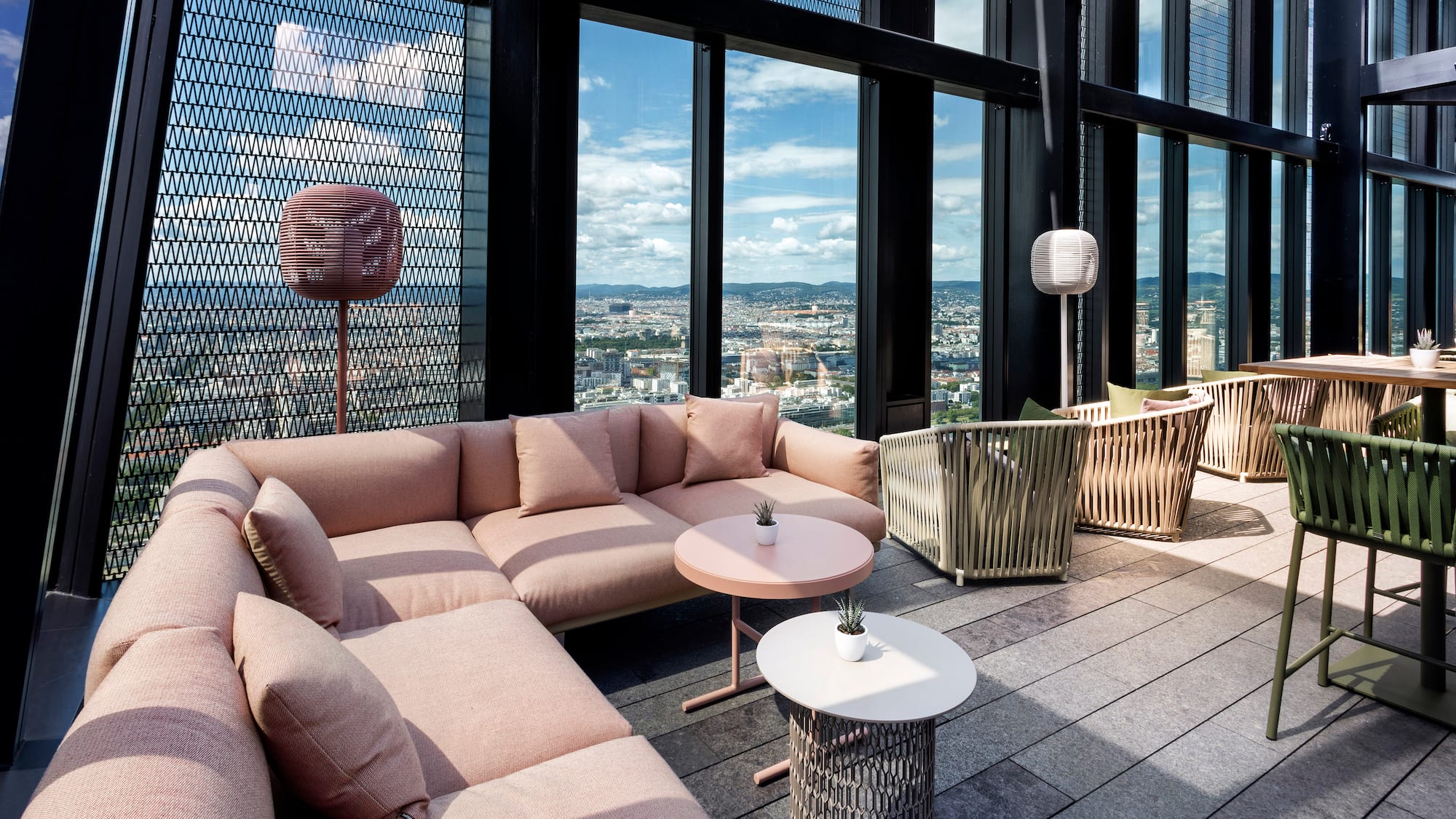 a room with a couch and tables and chairs