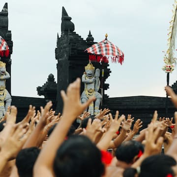 a group of people raising their hands