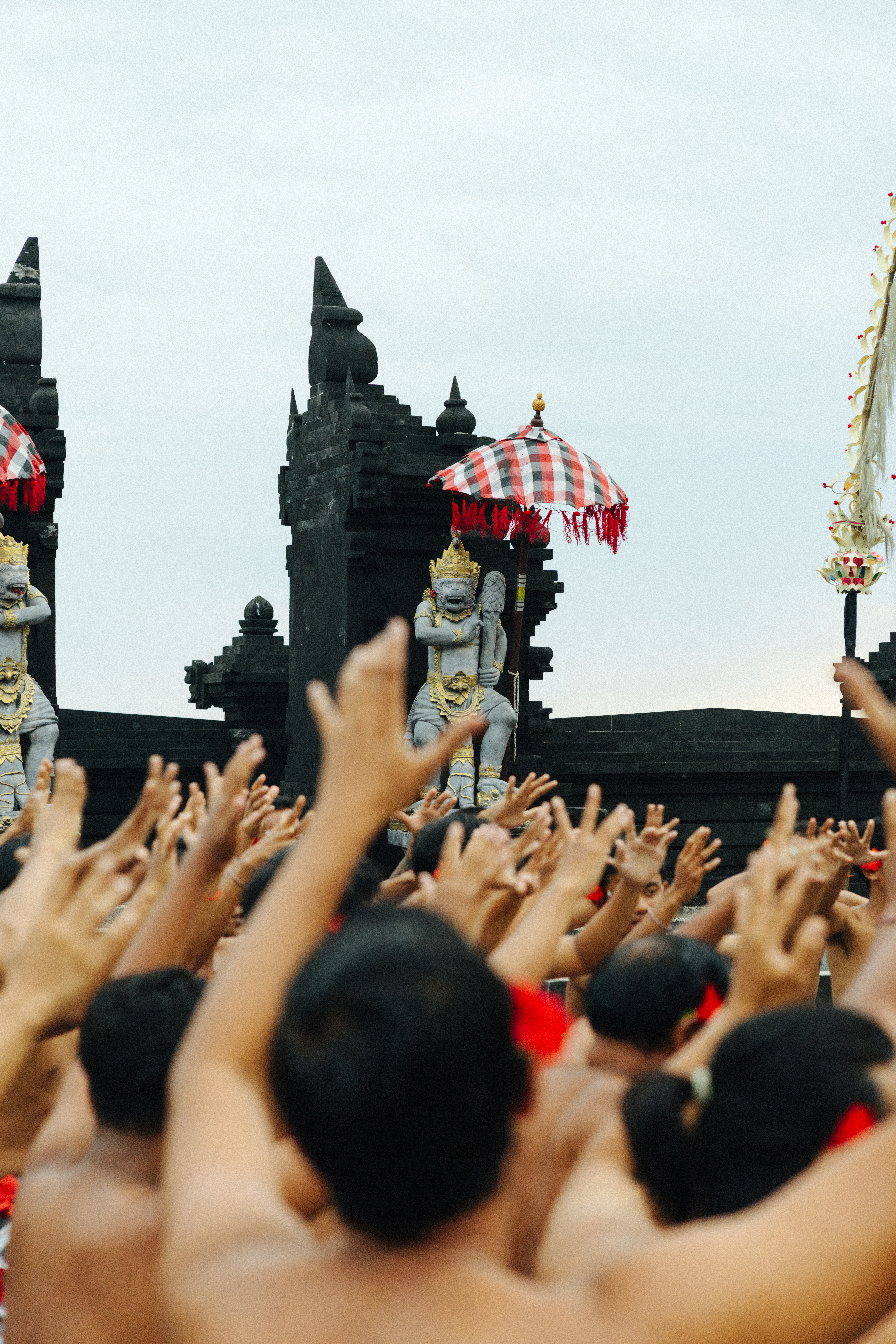 a group of people raising their hands